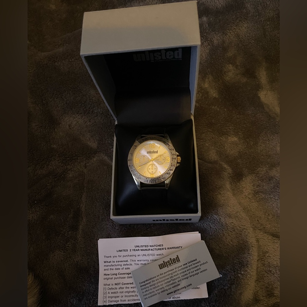 Unlisted Men’s Stainless steel w/black leather band